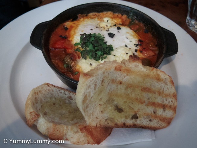 Shakshuka baked eggs with sweet peppers, tomato, spinach, creamed fetta and toast